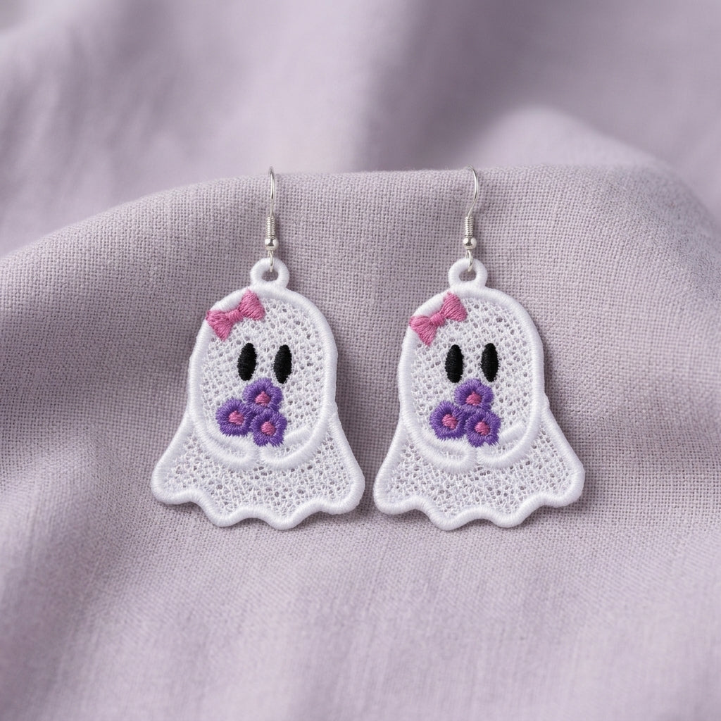Pair of white Ghost Girl FSL earrings with pink bows and purple flower bouquets displayed on lilac fabric