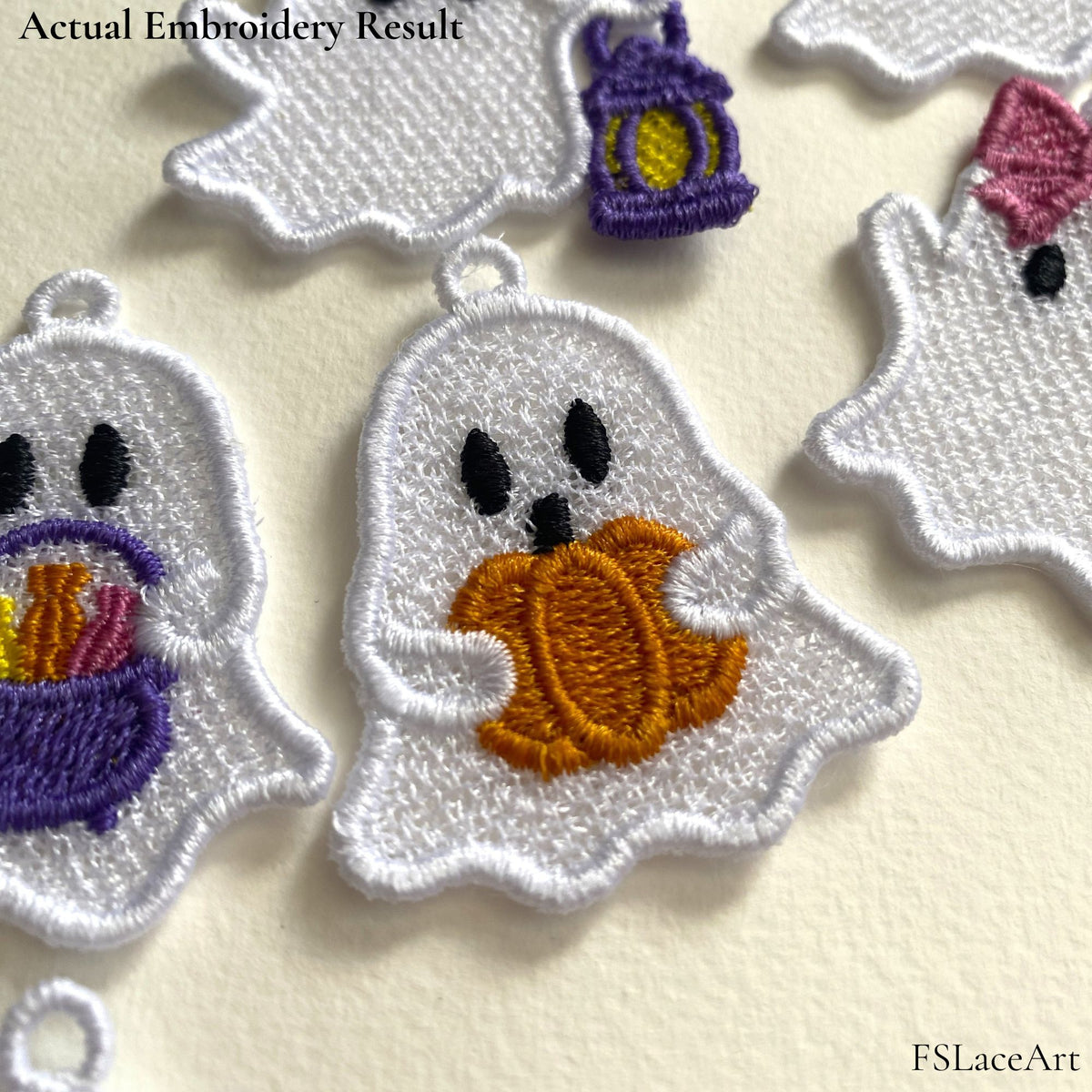 Actual white ghost FSL stitch-out holding an orange pumpkin and displayed among coordinating Halloween ghost designs