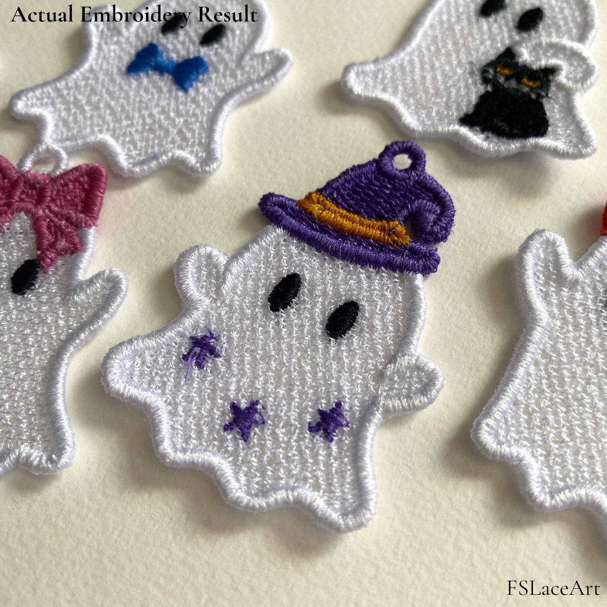 Actual white Ghost with Witch Hat FSL embroidery displayed among other finished Halloween ghost designs