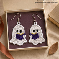 Reading ghost lace earrings with purple books and silver hooks in a cream gift box with a plum insert, styled beside a book.