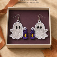 Mirrored Ghost with Lantern FSL earrings displayed in a gift box with autumn leaves