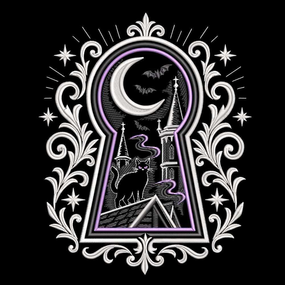 Gothic keyhole embroidery preview on dark fabric with a cat, crescent moon, bats and towers framed by pale scrollwork.