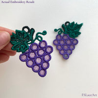 Actual purple Grape Cluster FSL embroidery held in hand with a second mirrored lace piece in the background