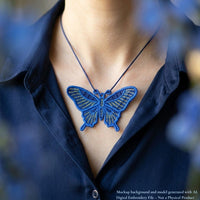 Large blue and gold swallowtail butterfly FSL pendant worn on a dark cord with a navy blouse