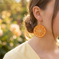 Orange FSL slice earring worn on model's ear