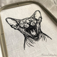 Close-up detail of stitched Sphynx cat embroidery showing fine line texture