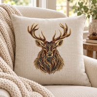 Cream linen cushion mockup with a detailed stag portrait embroidered in brown, cream and dark gray tones.